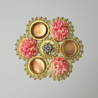 Pink Floral rangoli centerpiece with pearl and golden detailing